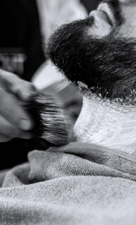 Barber trims beard